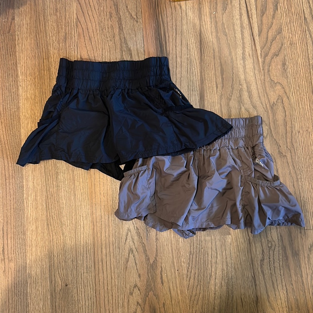 Free people movement “get your flirt on shorts”. Sized XS. Purple and Black